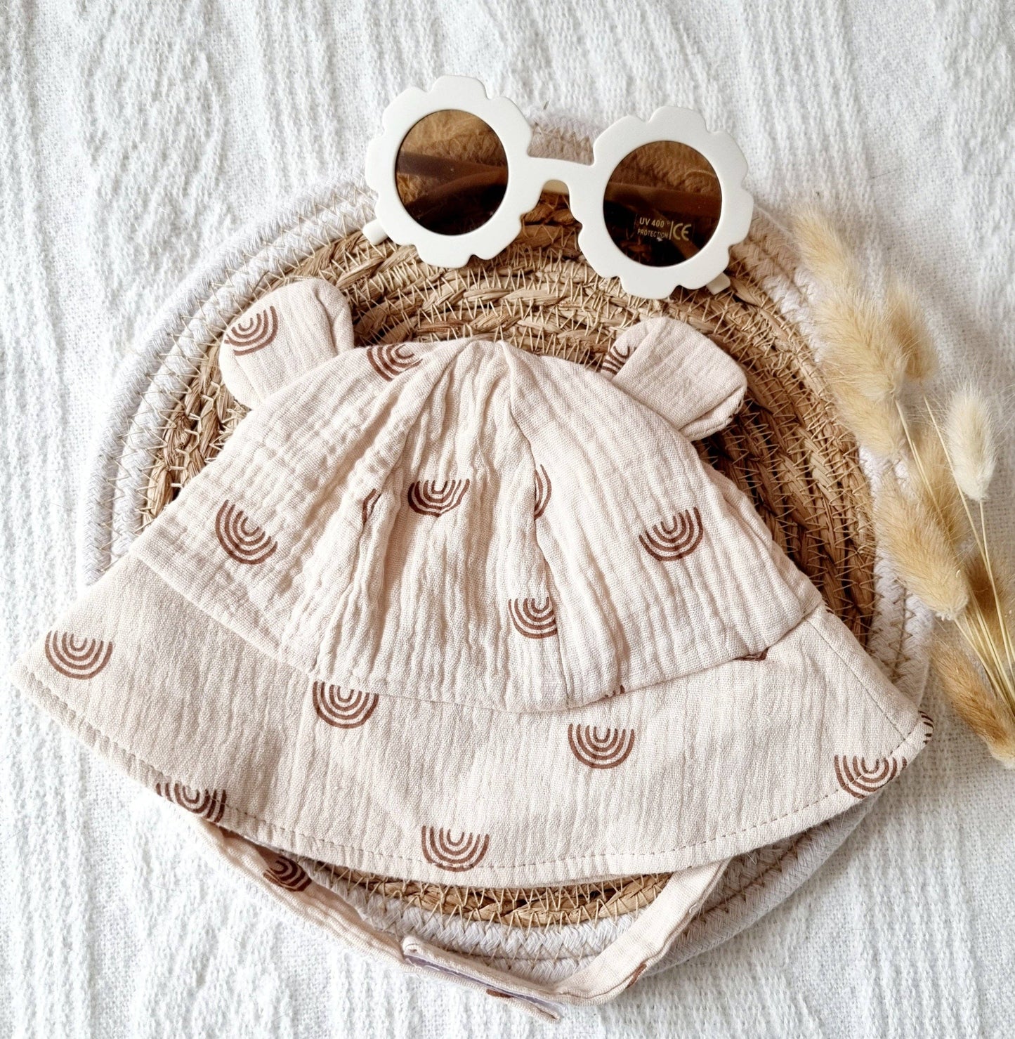 Cappello da sole Newborn in mussola con orecchie - Beige con arcobaleno